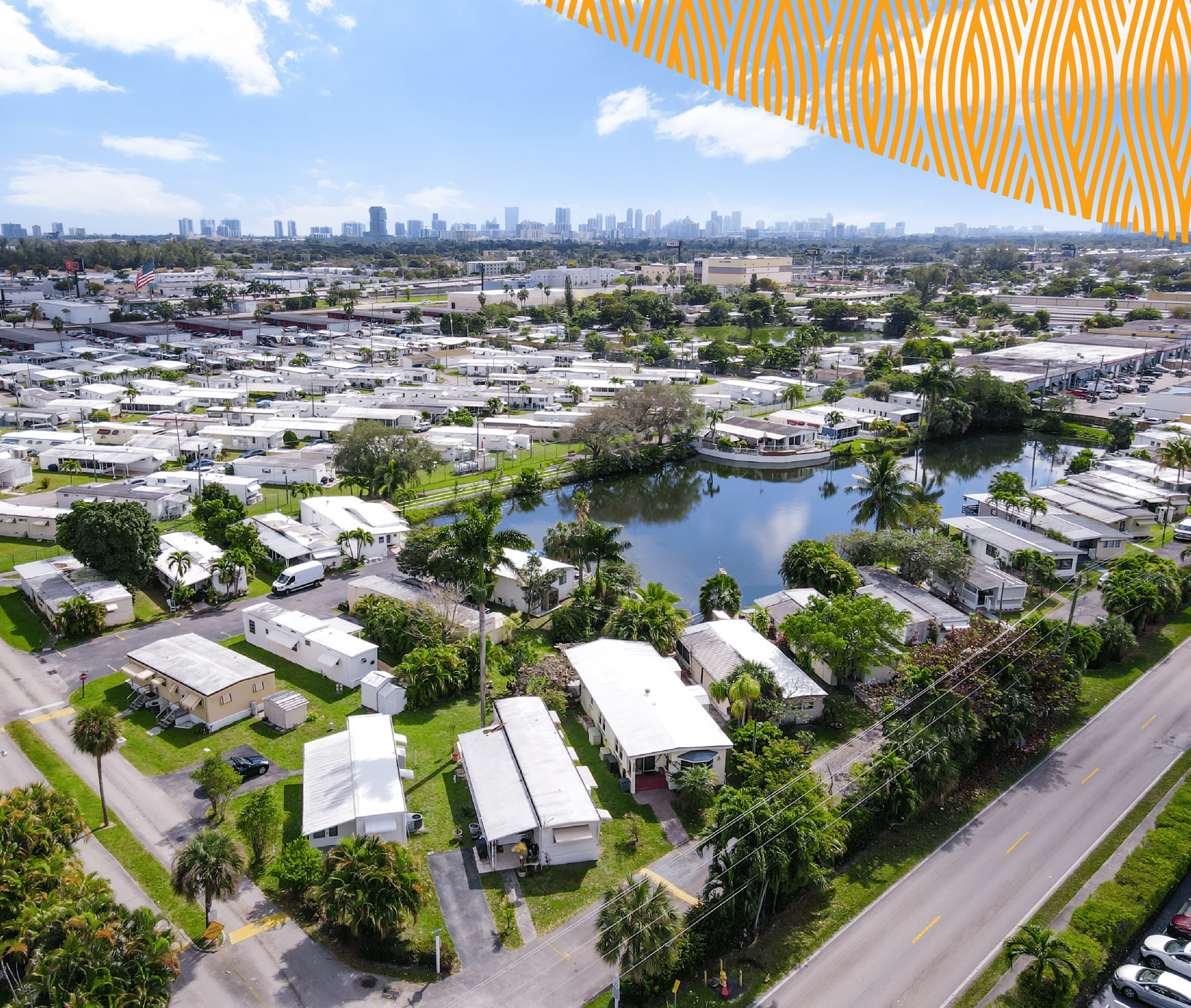 A Tropical Roots' Manufactured Housing Community with Palm Trees and a Large Pond